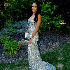 Sherri Hill No.53136 Fitted sequin gown with V neckline and lace up back.